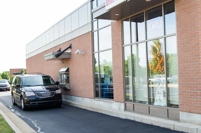 Car at drive-thru at pharmacy