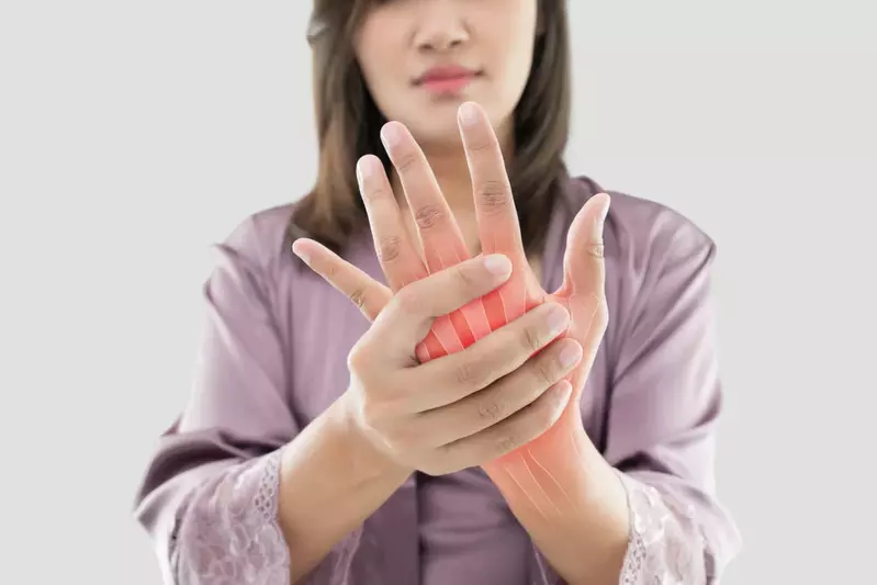 Woman with arthritis holding her hand