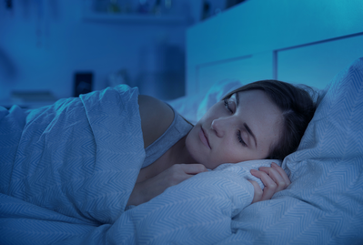 woman sleeping in bed at night