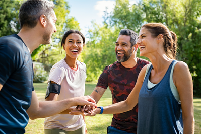 people laughing outside after a workout