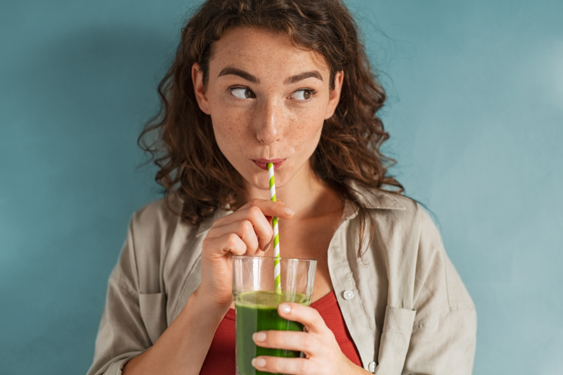 woman drinking detox drink