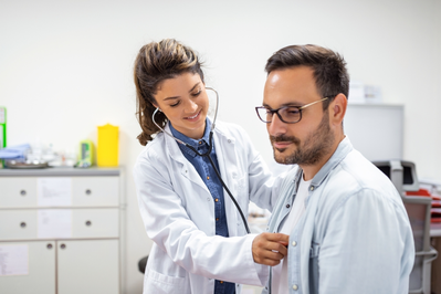 doctor checking heart rate in patient