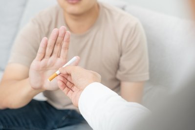 man rejecting cigarette