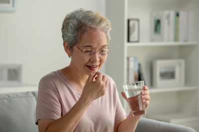 woman taking supplement