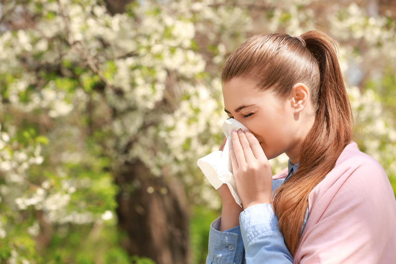 woman sneezing