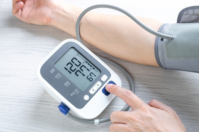 person checking blood pressure