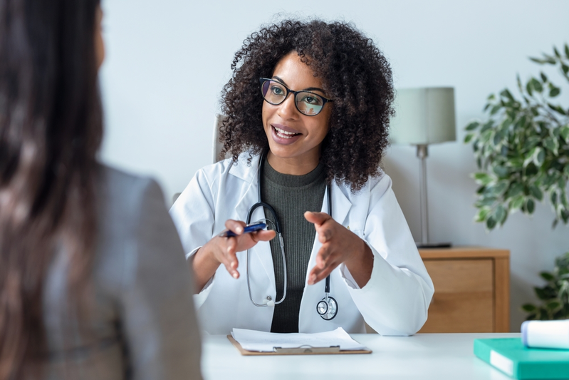 healthcare provider talking to woman