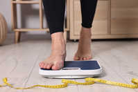 person stepping on scale