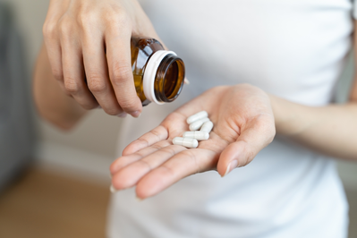 person taking supplements