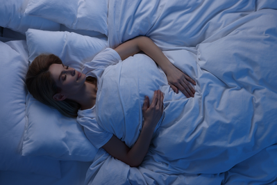 woman sleeping in bed