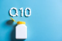 CoQ10 spelled out with supplement tablets