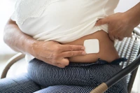 woman with a patch on her abdomen